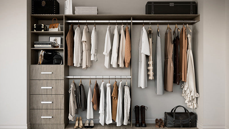 Closet with wooden shelves, hanging clothes, and a dresser.
