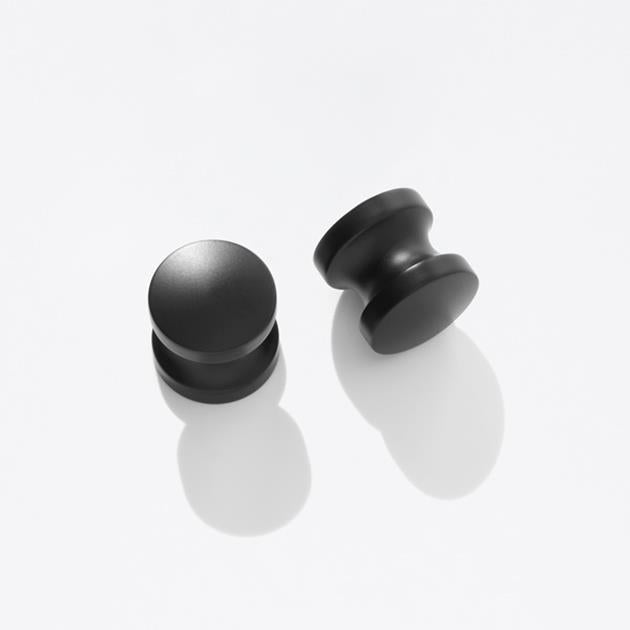 Two black door knobs