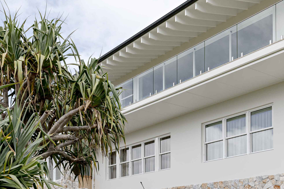 Modern house with double hung windows and garden area